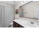 Bathroom featuring a single vanity, dark cabinets, updated fixtures, and shower-tub combo at 1821 Towne St, Johns Island, SC 29455