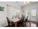Well-lit dining area with wood table and seating for six at 1821 Towne St, Johns Island, SC 29455
