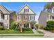 Charming two-story home featuring gray siding, black shutters, and a well-maintained front yard at 1821 Towne St, Johns Island, SC 29455