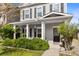 Welcoming front porch with white columns, green bushes, and a charming black front door at 1821 Towne St, Johns Island, SC 29455