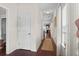 Inviting hallway with dark wood floors and natural light, leading to various rooms in the home at 1821 Towne St, Johns Island, SC 29455
