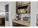Granite counter with appliances, storage, and open shelving at 1821 Towne St, Johns Island, SC 29455