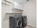 Bright laundry room with front load washer and dryer and lots of storage at 1821 Towne St, Johns Island, SC 29455