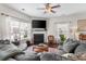 Bright living room featuring a fireplace, television, and plush couches at 1821 Towne St, Johns Island, SC 29455