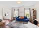 Comfortable living room showcasing a plush sofa, natural light, and hardwood floors, perfect for relaxation at 1821 Towne St, Johns Island, SC 29455