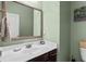 Charming half-bathroom featuring a stylish mirror and neutral decor at 1821 Towne St, Johns Island, SC 29455