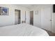 Bright bedroom showcasing neutral walls, carpet flooring, and entrances to closet and bath at 202 Kirkland St, Goose Creek, SC 29445