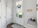 Bright entryway featuring a glass panel front door and white trim at 202 Kirkland St, Goose Creek, SC 29445