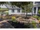 Picturesque backyard with a brick pathway, lush landscaping, and an inviting outdoor seating area at 208 Sumter Ave, Summerville, SC 29483