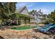 Stunning backyard with a pool and beautiful garden; ideal for upscale outdoor entertaining and relaxation at 208 Sumter Ave, Summerville, SC 29483