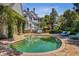 Picturesque backyard featuring a sparkling pool, ideal for serene outdoor relaxation and enjoyment at 208 Sumter Ave, Summerville, SC 29483
