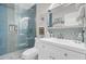 Stylish bathroom featuring blue mosaic tile, glass shower, and a whimsical sea turtle theme at 208 Sumter Ave, Summerville, SC 29483