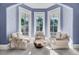 Cozy bay window seating area with three cushioned chairs and natural light perfect for relaxing and reading at 208 Sumter Ave, Summerville, SC 29483