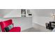 Bright bedroom space with a comfortable red chair and tasteful decor at 208 Sumter Ave, Summerville, SC 29483