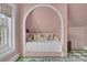 Charming bedroom nook with floral pillows and a cozy, inviting alcove bed at 208 Sumter Ave, Summerville, SC 29483