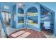 Bright bedroom boasts built-in bunk beds with arched alcoves and a connected study nook at 208 Sumter Ave, Summerville, SC 29483