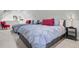 Inviting bedroom with twin beds, red accents, and natural light at 208 Sumter Ave, Summerville, SC 29483