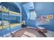 Charming blue bedroom features built-in bunk beds with a reading nook, a desk, and a colorful braided rug at 208 Sumter Ave, Summerville, SC 29483