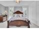 Spacious bedroom featuring a grand bed, beautiful windows, and built-in wardrobe at 208 Sumter Ave, Summerville, SC 29483