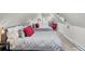 Spacious bedroom with two cozy beds, accented with red pillows at 208 Sumter Ave, Summerville, SC 29483