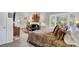 Comfortable bedroom featuring a large bed, a sitting area with a couch, and abundant natural light at 208 Sumter Ave, Summerville, SC 29483