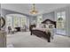 Comfortable bedroom with a large bed, ample natural light, and calming color scheme at 208 Sumter Ave, Summerville, SC 29483