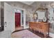 Entryway with floral wallpaper, a wooden dresser, and a view of the bright red front doors at 208 Sumter Ave, Summerville, SC 29483