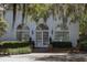 Charming home with arched windows, manicured landscaping, and traditional architecture at 208 Sumter Ave, Summerville, SC 29483