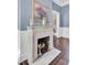 Charming marble fireplace with logs, perfect for cozy evenings at 208 Sumter Ave, Summerville, SC 29483