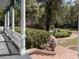 Charming front porch with garden, showcasing a delightful outdoor space at 208 Sumter Ave, Summerville, SC 29483
