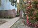 Elegant home exterior with brick walkway and garden, creating a welcoming approach at 208 Sumter Ave, Summerville, SC 29483