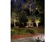 Beautifully lit gazebo nestled among mature trees and manicured landscaping creates a serene outdoor setting at 208 Sumter Ave, Summerville, SC 29483