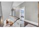 Bright hallway showcasing hardwood floors, detailed molding, and access to bedroom at 208 Sumter Ave, Summerville, SC 29483