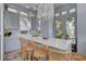 Bright kitchen features a large marble island with seating, stylish cabinets, and modern appliances at 208 Sumter Ave, Summerville, SC 29483