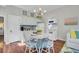 Eat-in kitchen with hardwood floors, updated appliances, and quaint dining table at 208 Sumter Ave, Summerville, SC 29483