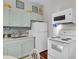 Charming kitchen with bright cabinets, modern appliances, and a stylish backsplash at 208 Sumter Ave, Summerville, SC 29483