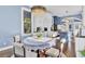Dining area adjacent to the kitchen with a round table and chairs, showcasing the open layout of the home at 208 Sumter Ave, Summerville, SC 29483