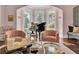 Bright and airy living room with grand piano and comfortable seating at 208 Sumter Ave, Summerville, SC 29483