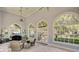 Bright living room with arched windows, light blue walls, and comfortable seating area at 208 Sumter Ave, Summerville, SC 29483