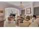 Sophisticated living room showcasing a grand piano, fireplace, and chic decor at 208 Sumter Ave, Summerville, SC 29483