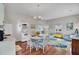 Open living area with hardwood floors, casual seating, and dining table at 208 Sumter Ave, Summerville, SC 29483