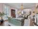 Large living room featuring beautiful pink walls, elegant furniture, and plenty of natural light at 208 Sumter Ave, Summerville, SC 29483