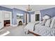 Bedroom features four-poster bed, fireplace, television, and access to other rooms throughout the home at 208 Sumter Ave, Summerville, SC 29483