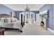 Spacious bedroom features four-poster bed, chandelier, fireplace, and bay window seating area with great lighting at 208 Sumter Ave, Summerville, SC 29483