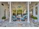 Spacious covered patio with stylish furniture and ceiling fans offers a relaxing outdoor retreat at 208 Sumter Ave, Summerville, SC 29483