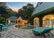 Inviting backyard with pool, lounge chairs, and a beautiful building - ideal for outdoor relaxation and entertaining at 208 Sumter Ave, Summerville, SC 29483