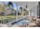 Inviting porch with comfortable seating and decorative hanging plants at 208 Sumter Ave, Summerville, SC 29483