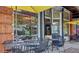 Restaurant exterior with outdoor seating and shade umbrellas, located in the city at 208 Sumter Ave, Summerville, SC 29483