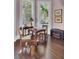 Bright sitting room with dark wood floors, tall windows, and chess table at 208 Sumter Ave, Summerville, SC 29483