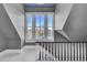 Bright staircase with white railings, large windows, and wood accents at 208 Sumter Ave, Summerville, SC 29483